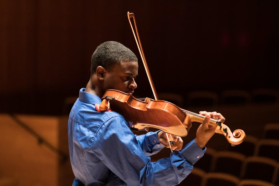 Violinist performing solo at the University of Rochester Eastman School of Mucis